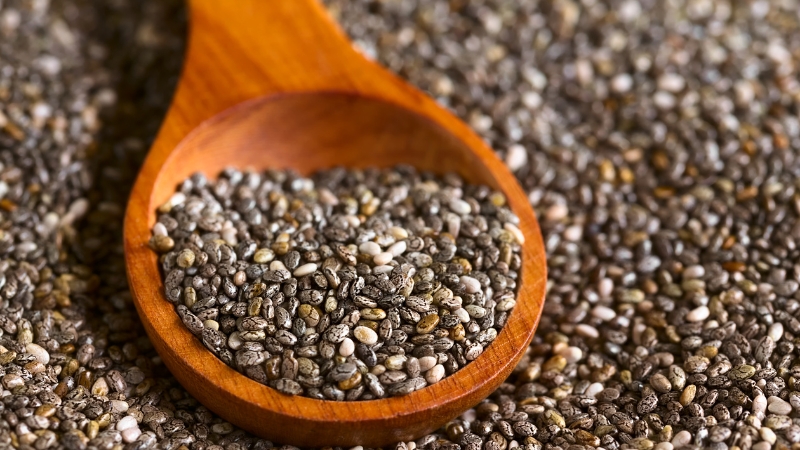 Wooden spoon filled with chia seeds